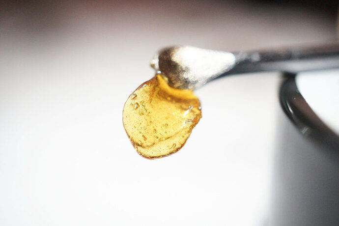 A small piece of cannabis wax on a metal spoon